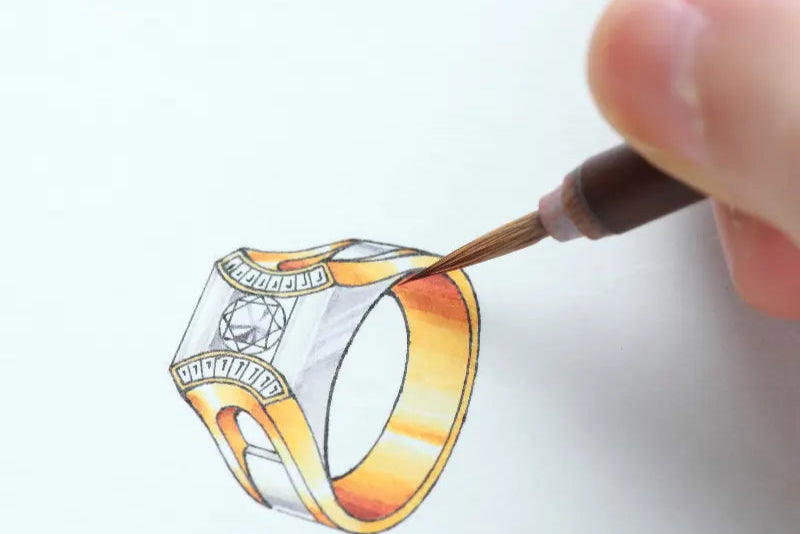 Illustration d’une bague en or et diamant en cours de dessin, symbolisant la première étape de conception d’un bijou sur-mesure. Mael gems bijoux sur mesure et pierres précieuses